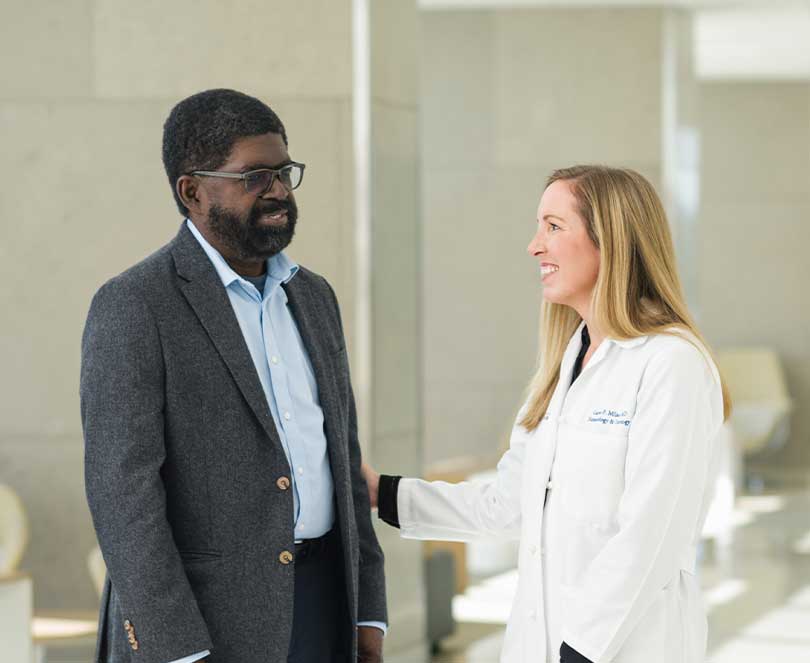 Photo of a patient and a UMMC Doctor, smiling and conversing