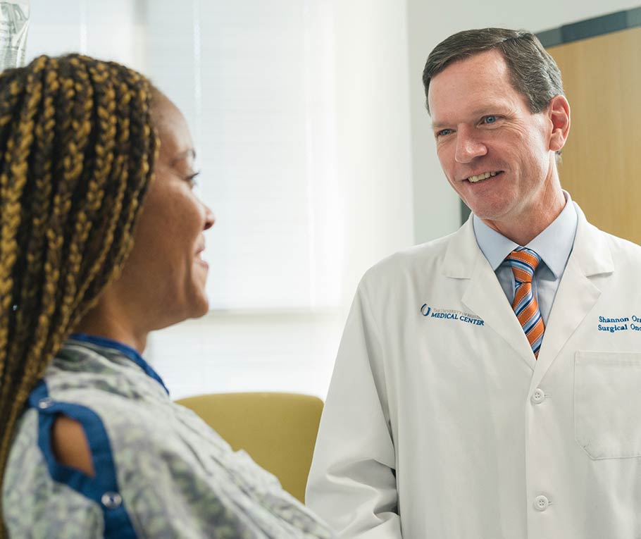 UMMC doctor conversing with patient